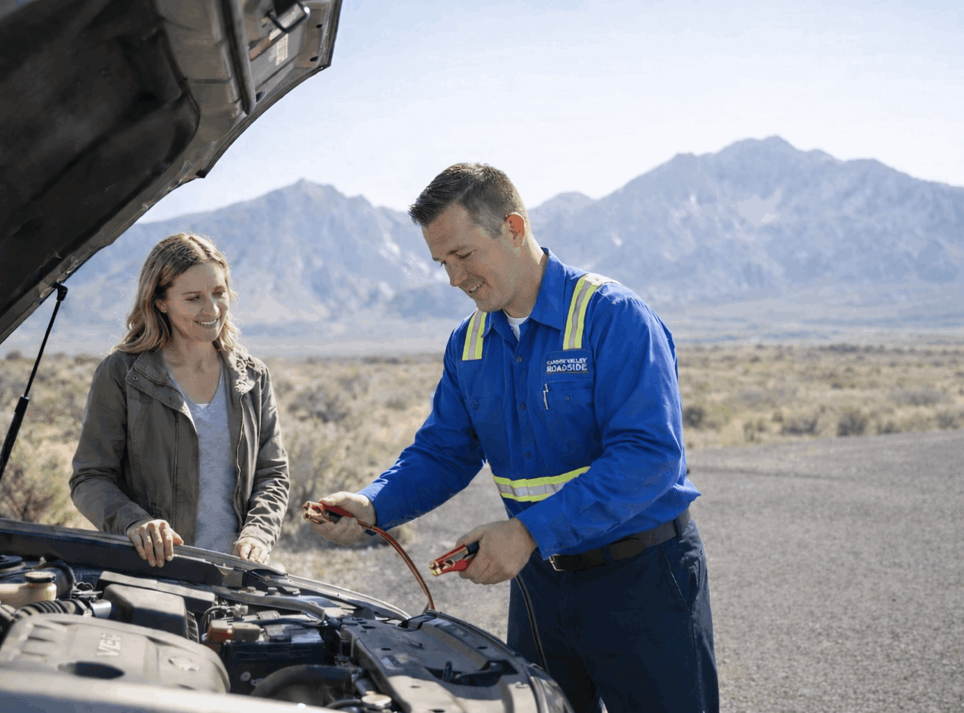 Sierra Roadside Rescue helping a customer with a roadside battery jumpstart